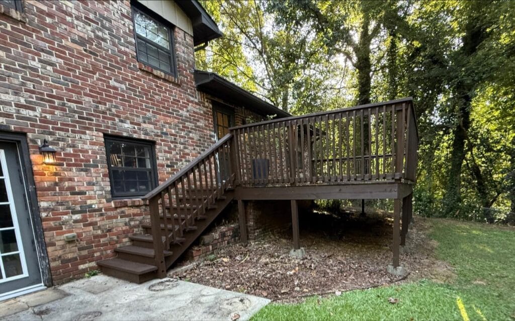 Backyard deck transformation in Helena, AL featuring new framing, modern horizontal slat railings, enclosed bottom, and pressure‑treated lumber built by Platinum Fence Deck and Exteriors.