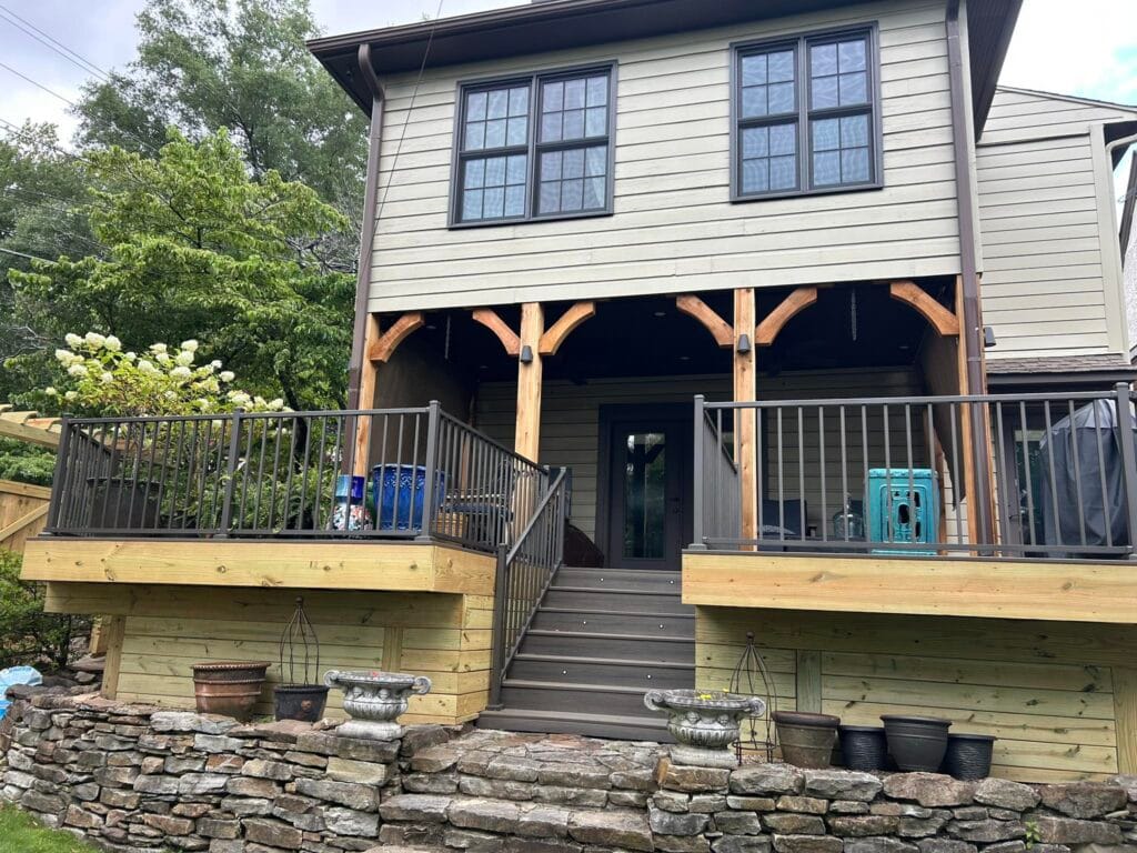 Picture of newly built elevated deck using pressure-treated lumber with composite decking and aluminum railings in Helena, AL