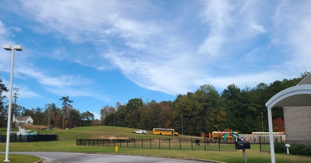 Playground fence installation at Helena Intermediate School to improve student safety near roadway.