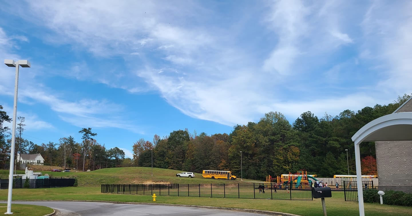 Playground fence installation at Helena Intermediate School to improve student safety near roadway.