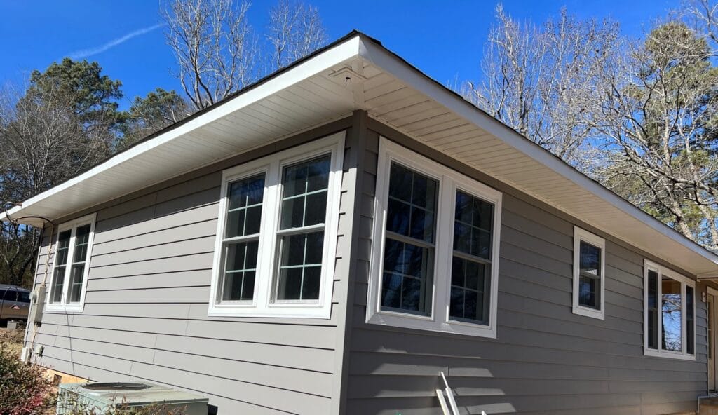 Grey house in Shelby County, after a finished siding replacement/installation project by the team at Platinum Fence Deck and Exteriors
