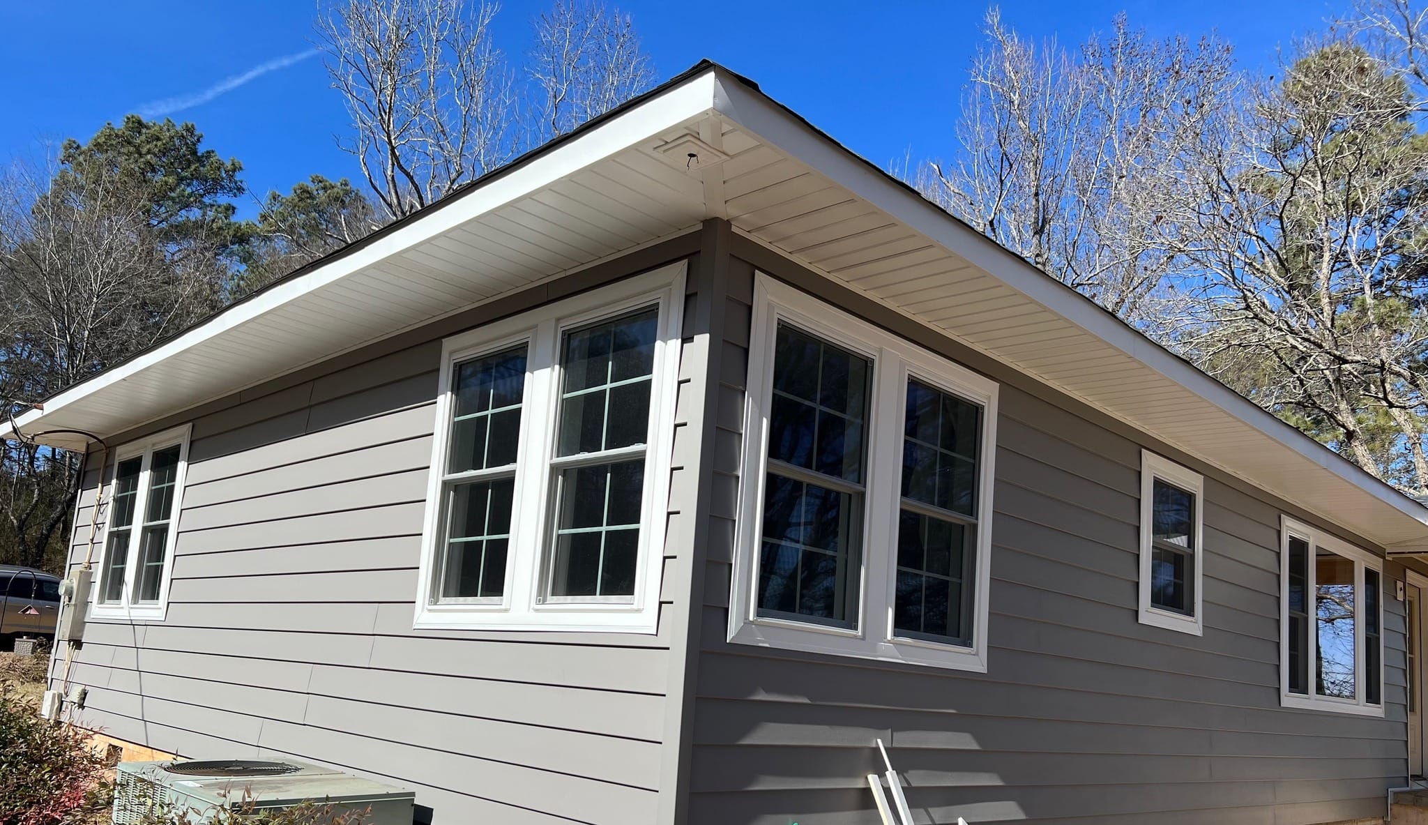 Grey house in Shelby County, after a finished siding replacement/installation project by the team at Platinum Fence Deck and Exteriors