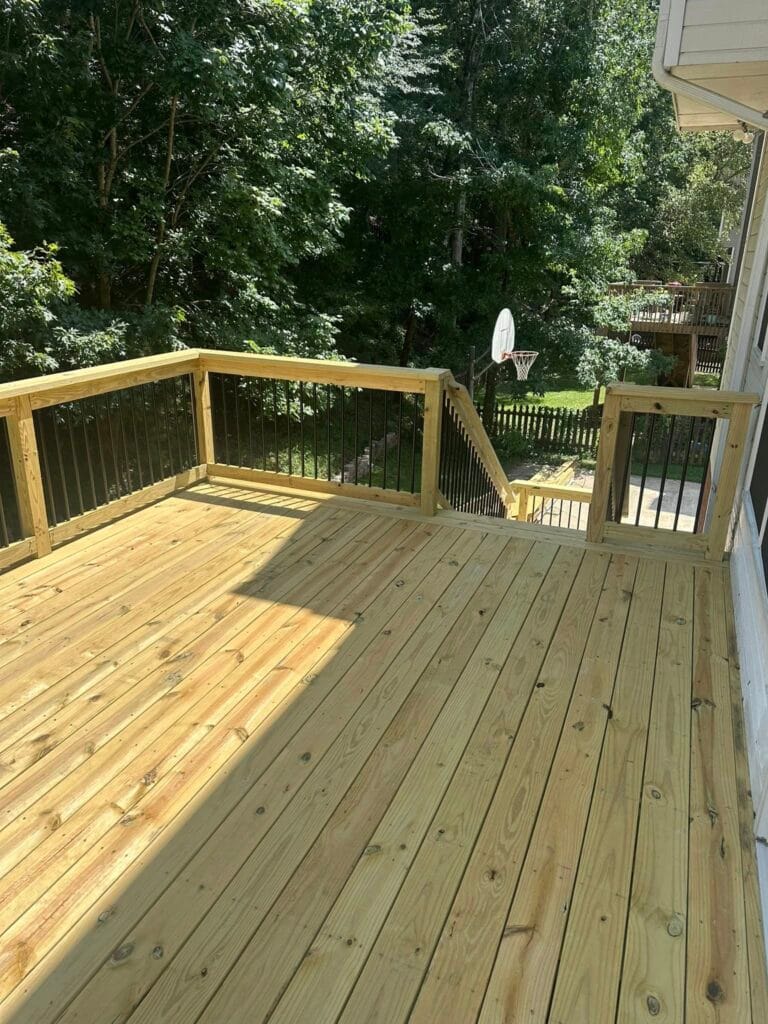 New deck construction project in Hoover, AL with modern black balusters, offering a perfect space for relaxation, entertainment, and outdoor enjoyment.