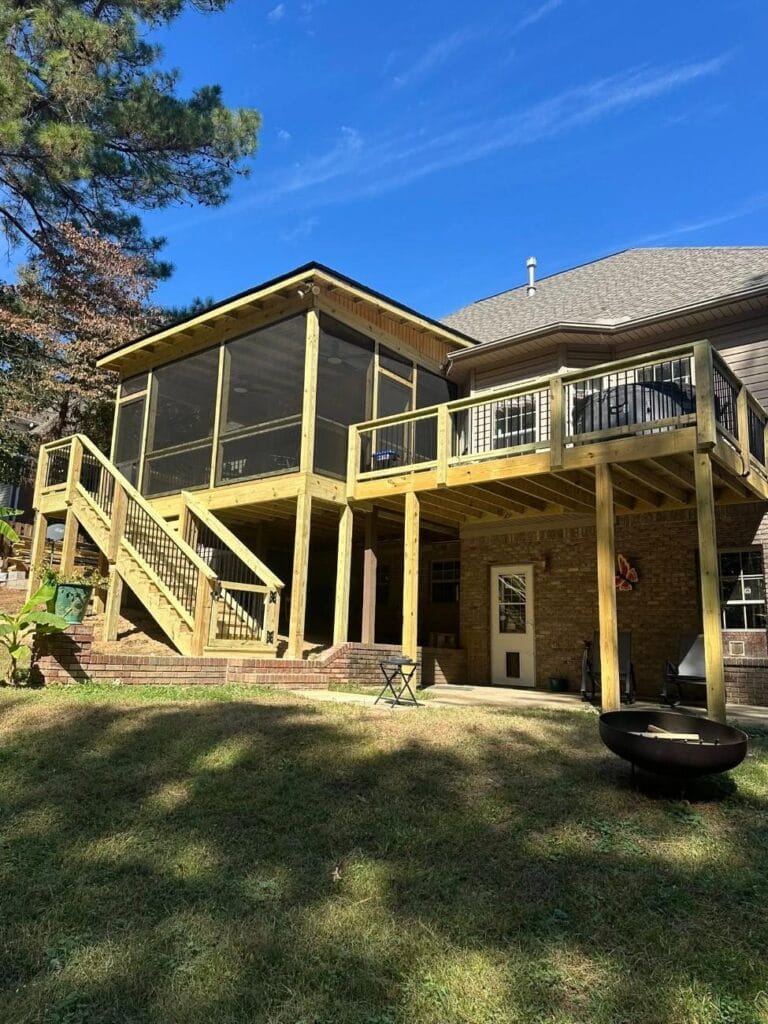18’x17’ pressure-treated wood deck with screened-in porch using the SCREENEZE system, featuring a shingle roof, black aluminum balusters, and double outdoor ceiling fans in Helena, Alabama